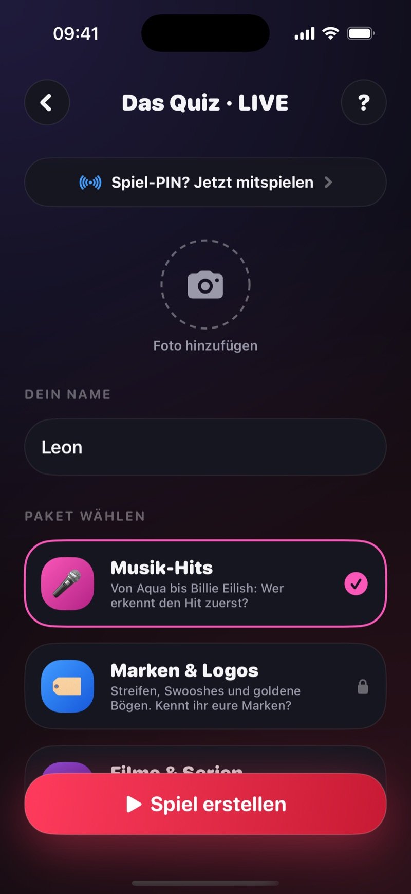 Erstellen-Screen von Das Quiz LIVE in Dronk: eine Zeile Got a game pin? Join the game, ein Kreis Add photo, Your name auf Jacob gesetzt, Pick a pack mit Music Hits ausgewählt und Brands & Logos mit Schloss-Symbol, und ein Button Create game